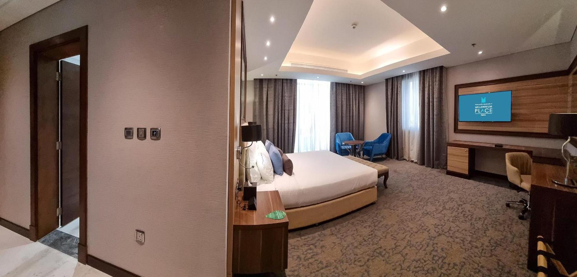 Millennium Place Ad Dawhah Esterno foto A bedroom at the hotel